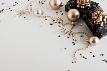 Christmas background . New Year decorations in gold colors on beige  background. Top view. copy space
