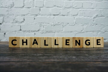 Challenge word alphabet letters on wooden background