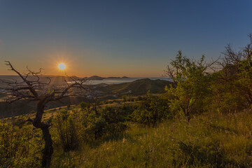 A beautiful village on the Black Sea coast of Koktebel. Unforgettable sunrises and sunsets in summer in the Crimea.