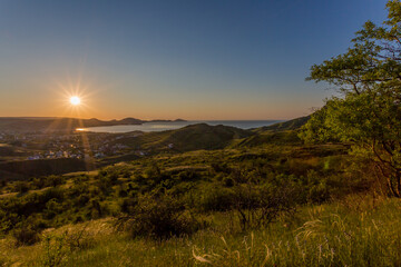 A beautiful village on the Black Sea coast of Koktebel. Unforgettable sunrises and sunsets in summer in the Crimea.