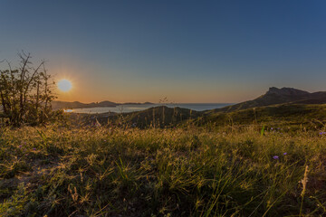 A beautiful village on the Black Sea coast of Koktebel. Unforgettable sunrises and sunsets in summer in the Crimea.