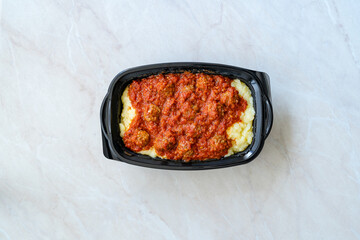 Take Away Turkish Food Meatballs with Potato Puree and Tomato Paste.