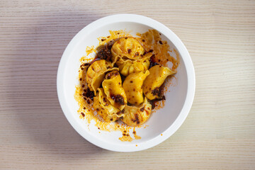 A bowl of spicy dumpling.