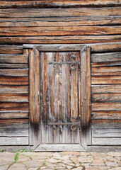 Old wooden door with a in a wooden wall. Quality image for your project