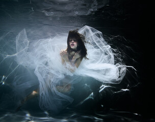 Woman in the water in white dress
