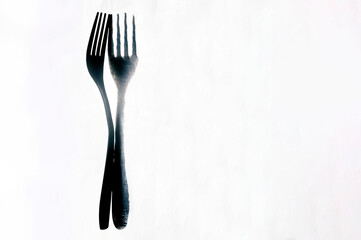 Reflection of a fork against the light. Food, bistro and restaurant concept