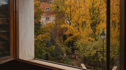 View from the window on a small village park in autumn.