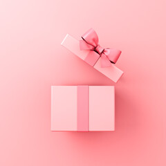 Opened gift box or blank pink pastel color present box tied with pink ribbon and bow isolated on pink pastel color wall background with shadow minimal conceptual 3D rendering