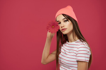 woman in pink hat red flower romance posing model