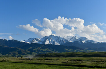 Mountain landscape with clouds and road, Kazakhstan, Almaty region