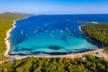 Aerial view of sailing boats in a beautiful azure turquoise lagoon on Sakarun beach bay on Dugi...