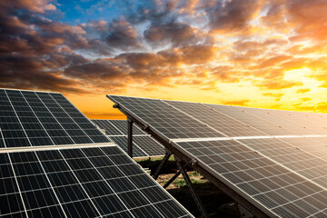 Solar power panels and beautiful natural landscape at sunset in summer in China