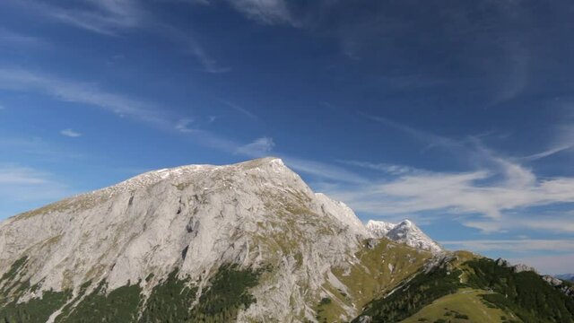 Alpine choughs flying in Berchtesgaden Alps in fall. View from the peak of Jenner Mountain.
