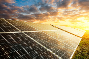 Solar power panels and beautiful natural landscape at sunset in summer in China