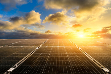 Solar power panels and beautiful natural landscape at sunset in summer in China