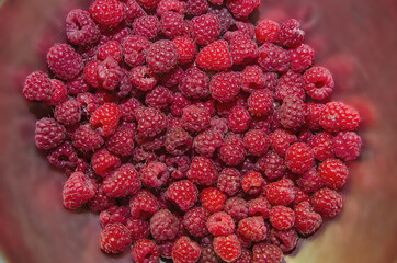raspberries in a bowl, background with raspberries, freshly picked raspberries