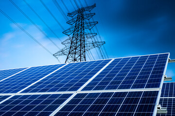 Solar power panels and high voltage power tower background landscape in China