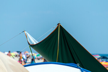 Green tent on the beach