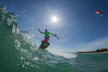 A kite surfer rides the waves