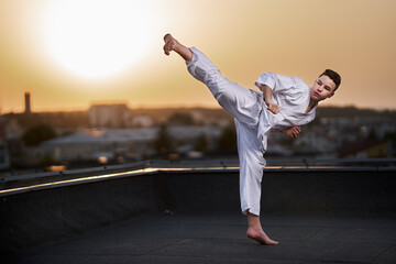 Fototapeta na wymiar Teenager karate fighter