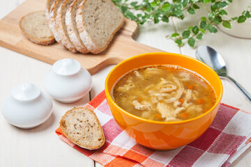 Traditional polish tripe soup with vegetables.