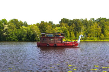 Viking style boat driving on a lake in summer