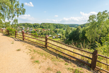 Fototapeta na wymiar Scenic view of town of Plyos on bank of Shokhonka river in summer, Ivanovo region, Russia.