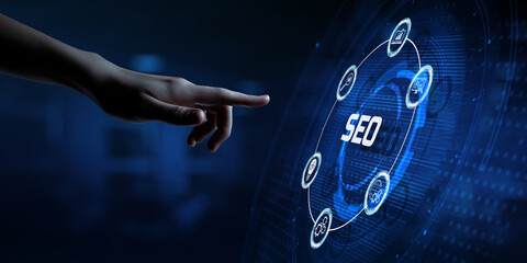 SEO Search engine optimisation digital internet marketing concept. Hand pressing button on screen.