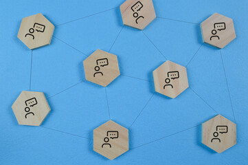 Fototapeta premium Wooden block with connecting peoples. Social network concepts