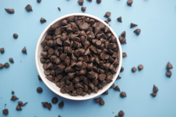 Chocolate chips spilling from a plastic packet,