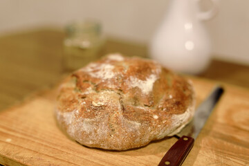 Homemade sourdough bread in a conventional oven. - 449175048