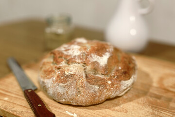 Homemade sourdough bread in a conventional oven. - 449175059