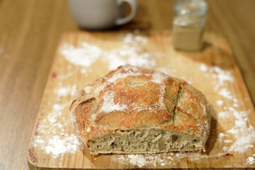 Homemade sourdough bread in a conventional oven. - 449175493