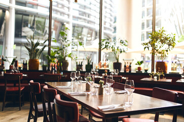 Tables set for dinner in restaurant