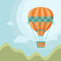 Orange and green striped hot air balloon with clouds and blue sky in the background and mountains. Poster