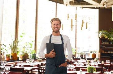 Portrait of restaurant owner smiling