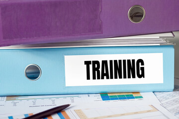 A lignt blue folder with the label TRAINING.