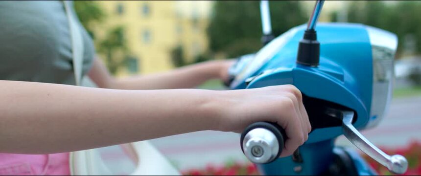 Motorbike handle grips. Close up the hand of the motorcyclist holds the trottle.