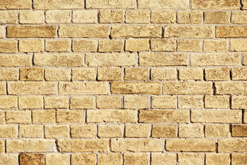 Beige brick wall. Abstract textured brick background. Space for text.