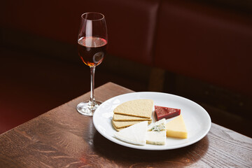 Wine and cheese plate in restaurant