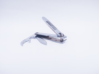 nail cutter with knife and bottle opener, isolated on white background