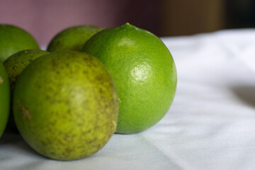 Green sweet lemon on a surface