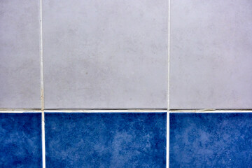 Blue and white wall background. Tiles in the bathroom. 