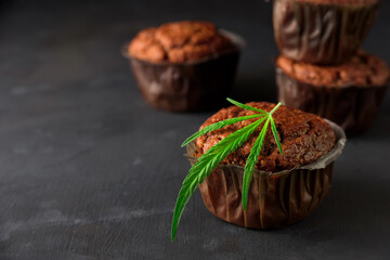 Chocolate muffin or cake with cannabis leaf, cbd infused