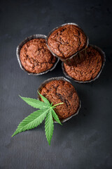 Chocolate muffin or cake with cannabis leaf, cbd infused