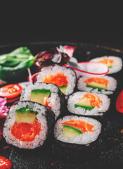 sushi roll in plate on wooden table background