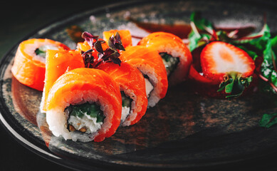 sushi roll in plate on wooden table background