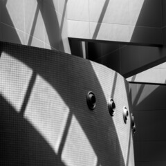 A black and white abstract architectural photo. Shadow and light effect on an architectural structure.