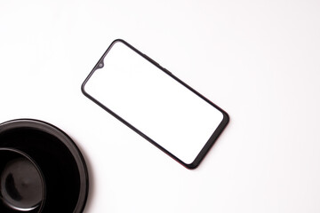 cell phone, cup, glasses on a white background