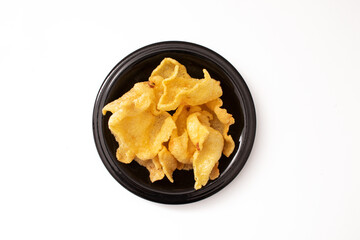 snacks on a black plate on a white background
